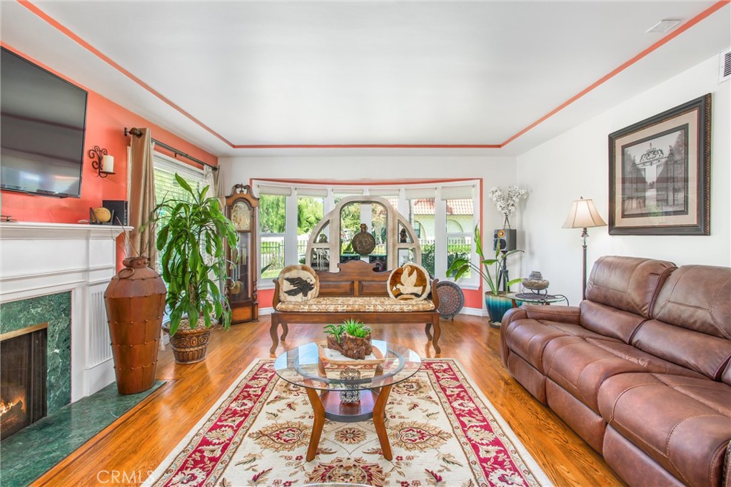 3095 Pepper Tree Lane San Bernardino, CA 92404 - Photo 5 of 29 a living room with furniture and a fireplace