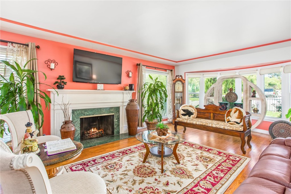 3095 Pepper Tree Lane San Bernardino, CA 92404 - Photo 6 of 29 a living room with furniture and a fireplace