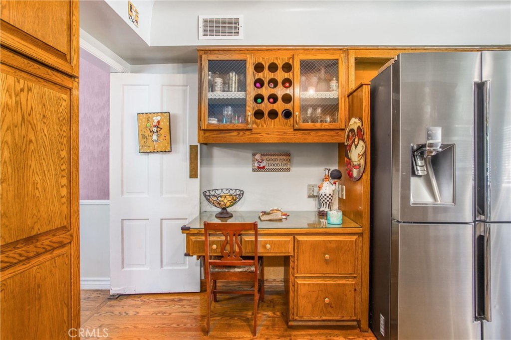 3095 Pepper Tree Lane San Bernardino, CA 92404 - Photo 9 of 29 a kitchen with stainless steel appliances granite countertop a refrigerator and a stove