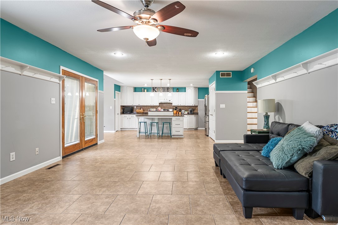 155 Ridgewood Boulevard Belpre, OH 45714 - Photo 18 of 49 Living area with a ceiling fan and light tile patterned floors