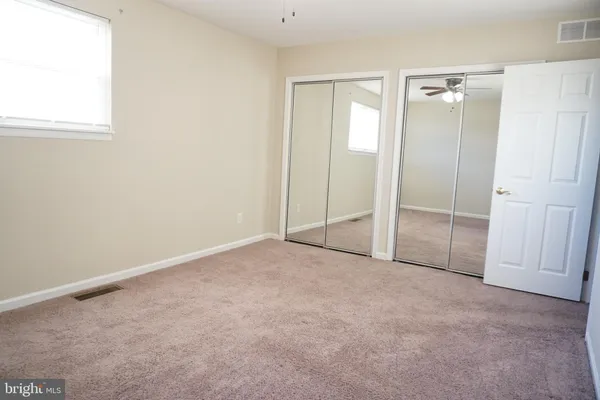 an empty room with sliding door