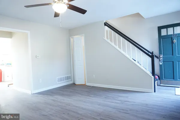 a view of an entryway with wooden floor