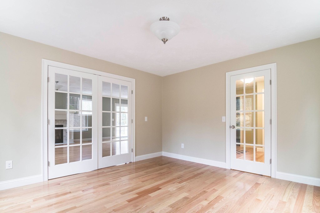 375 New Boston Road Sturbridge, MA 01566 - Photo 7 of 28 a view of an empty room with wooden floor and windows
