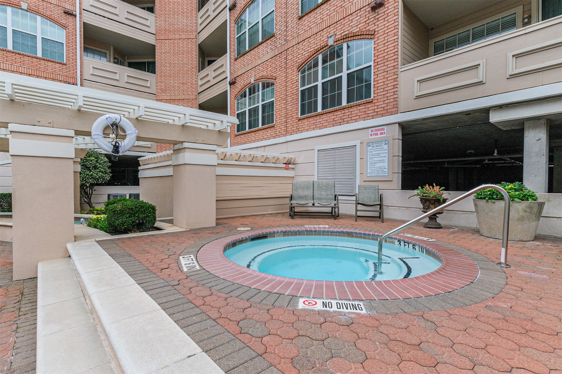 2111 Welch Street, Unit B304 Houston, TX 77019 - Photo 29 of 37 a view of a patio with swimming pool table and chairs
