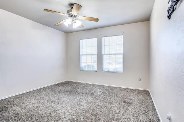 a view of a chairs and tables in the patio