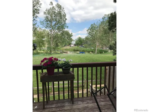 a view of a two chairs in the balcony