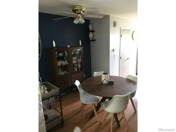 a table and chairs in a small room
