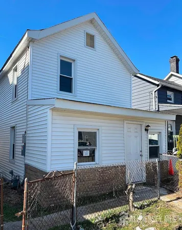 a front view of a house with garage
