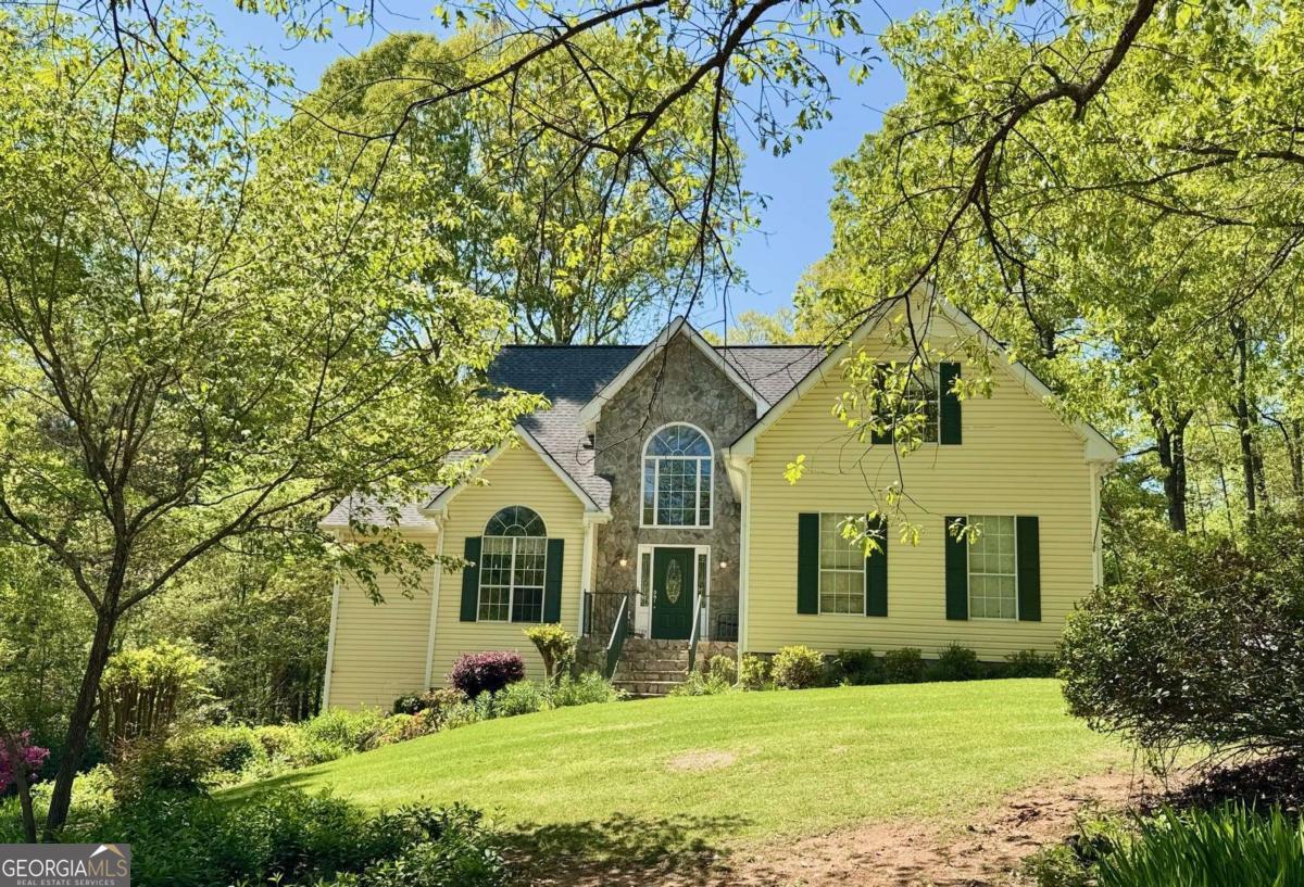 a front view of a house with a yard