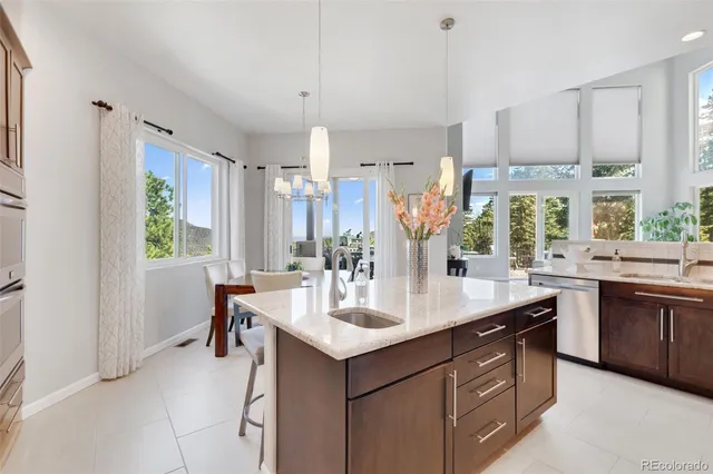 a kitchen with a sink stove and cabinets