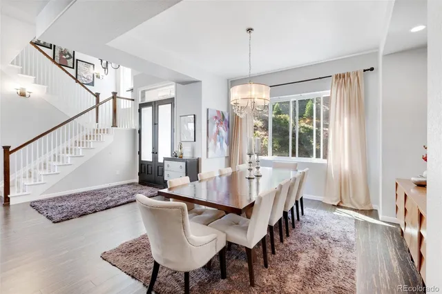 a view of a dining room with furniture window and wooden floor