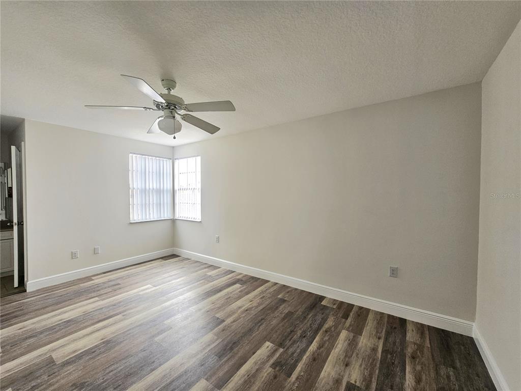411 Australian Way Davenport, FL 33897 - Photo 17 of 24 wooden floor in an empty room