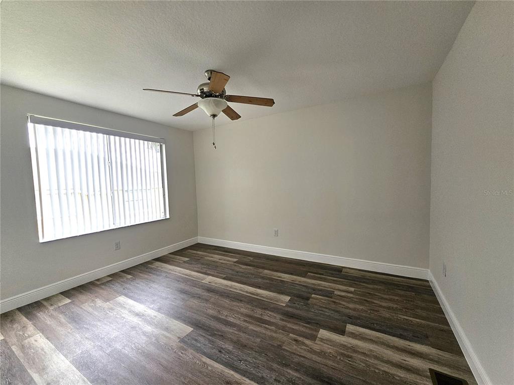 411 Australian Way Davenport, FL 33897 - Photo 24 of 24 a view of room window and wooden floor