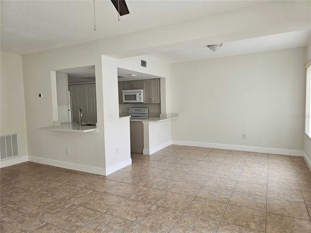 411 Australian Way Davenport, FL 33897 - Photo 8 of 24 a view of a kitchen with a sink