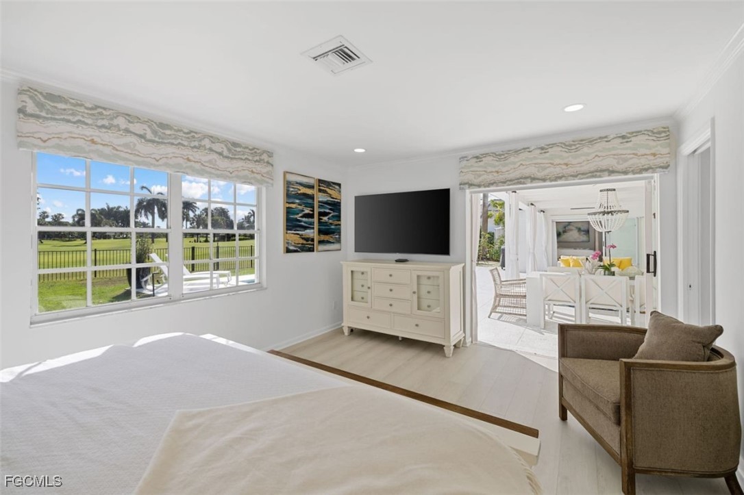 2728 Crayton Road Naples, FL 34103 - Photo 18 of 35 a living room with furniture tv and large window