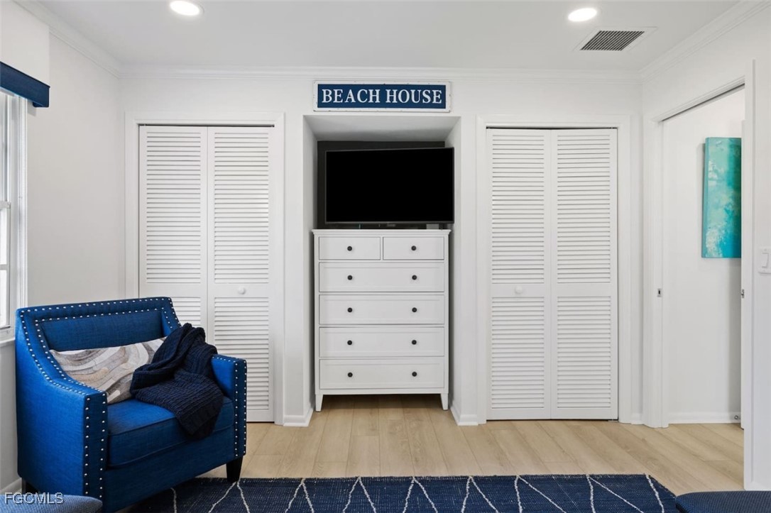 2728 Crayton Road Naples, FL 34103 - Photo 22 of 35 a living room with furniture and a flat screen tv