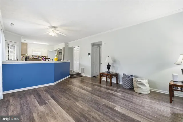 a view of kitchen with wooden floor and window