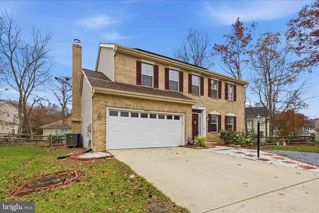 a front view of a building with a yard