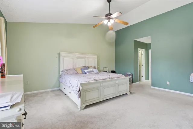 a bedroom with a bed and a chair