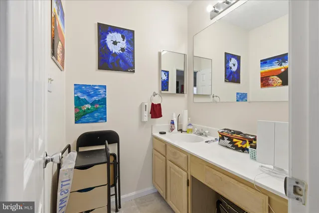 a bedroom with a bed and lamp