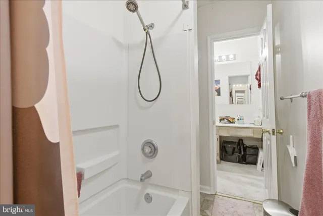 a bed room with a bed and a television