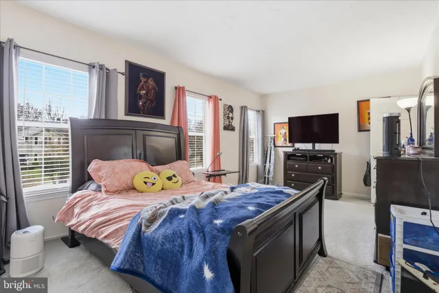 a backyard of a house with barbeque oven table and chairs