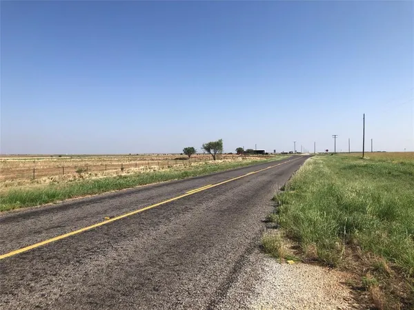 a view of a road with an ocean view