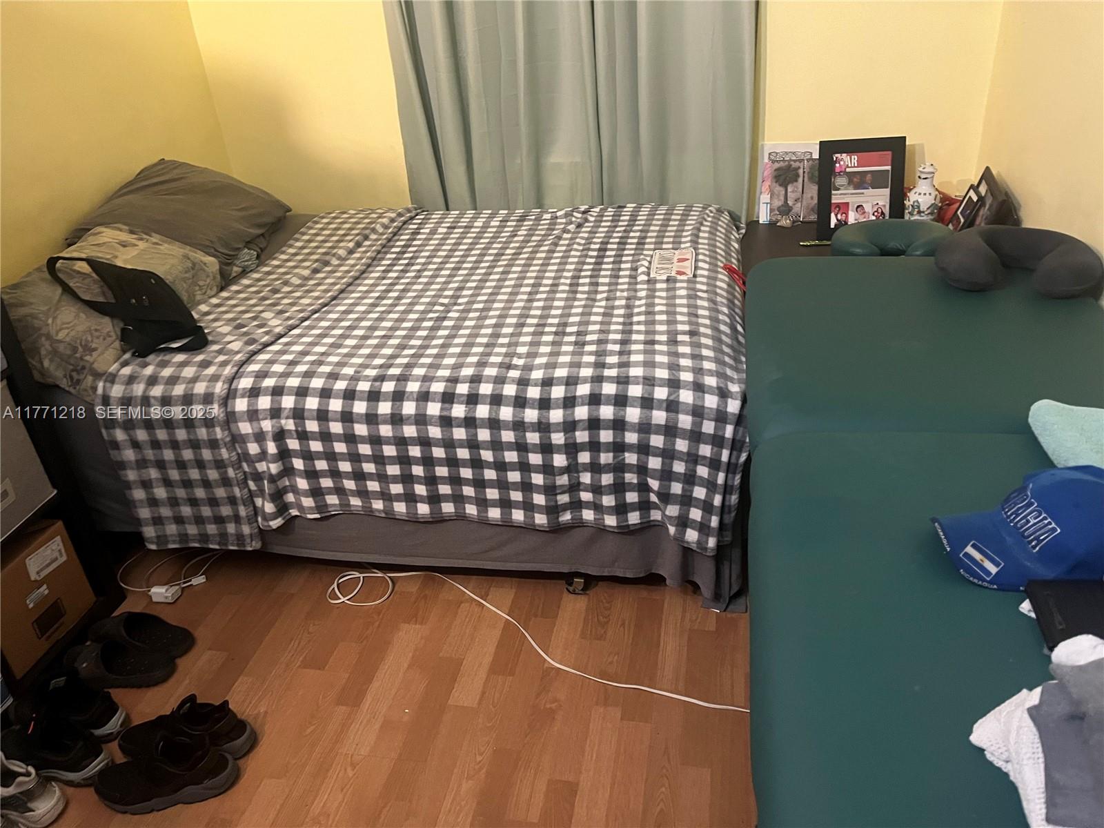 11041 Southwest 166th Terrace Miami, FL 33157 - Photo 28 of 33 a bedroom with a bed and cabinets