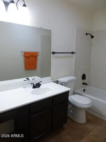 an empty room with a empty space and a ceiling fan