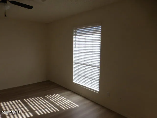 a view of empty room with a fireplace