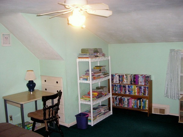48 East Allen Ridge Road Springfield, MA 01118 - Photo 13 of 25 a room with furniture and a bookshelf
