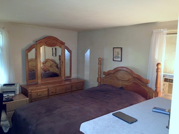48 East Allen Ridge Road Springfield, MA 01118 - Photo 8 of 25 a bedroom with a bed and a painting on the wall