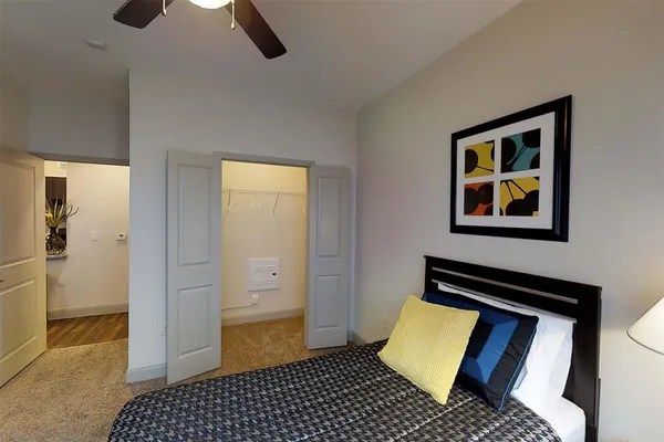 a bedroom with bed and window