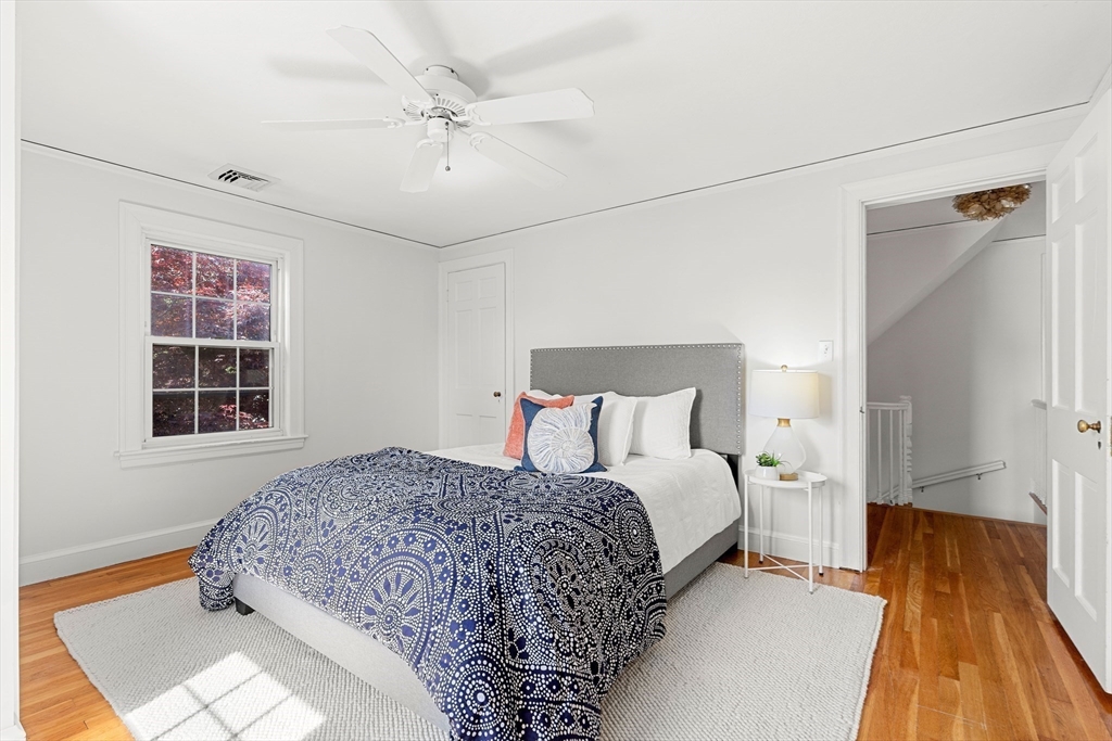 6 Shetland Road Marblehead, MA 01945 - Photo 24 of 39 a bedroom with a bed and a chandelier