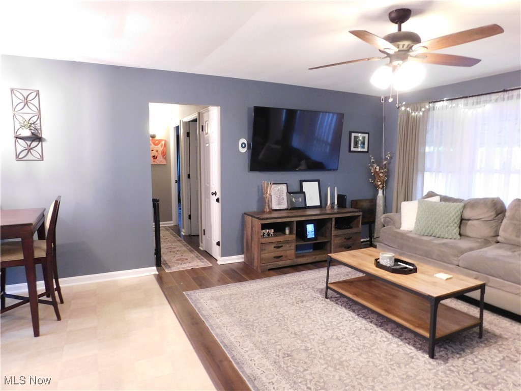 9720 West Ridgewood Drive Parma Heights, OH 44130 - Photo 5 of 46 Living room with a ceiling fan, wood finished floors, and baseboards