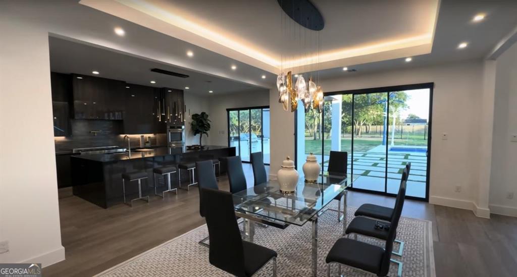 6711 Bishop Road Fairburn, GA 30213 - Photo 6 of 7 a living room with furniture and a large window