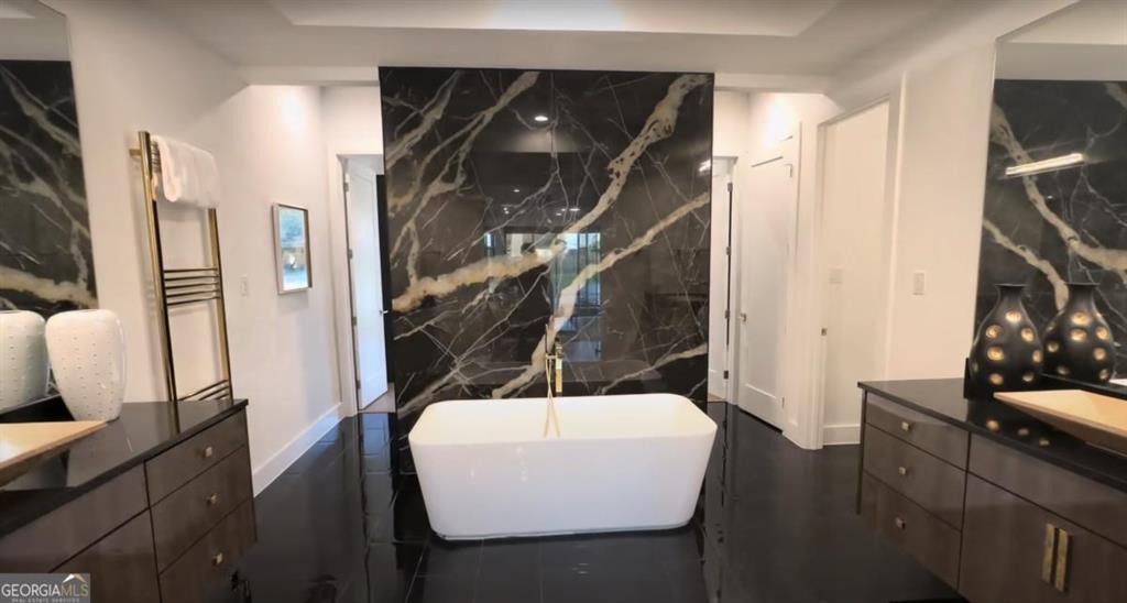 6711 Bishop Road Fairburn, GA 30213 - Photo 7 of 7 a bathroom with a sink and a mirror