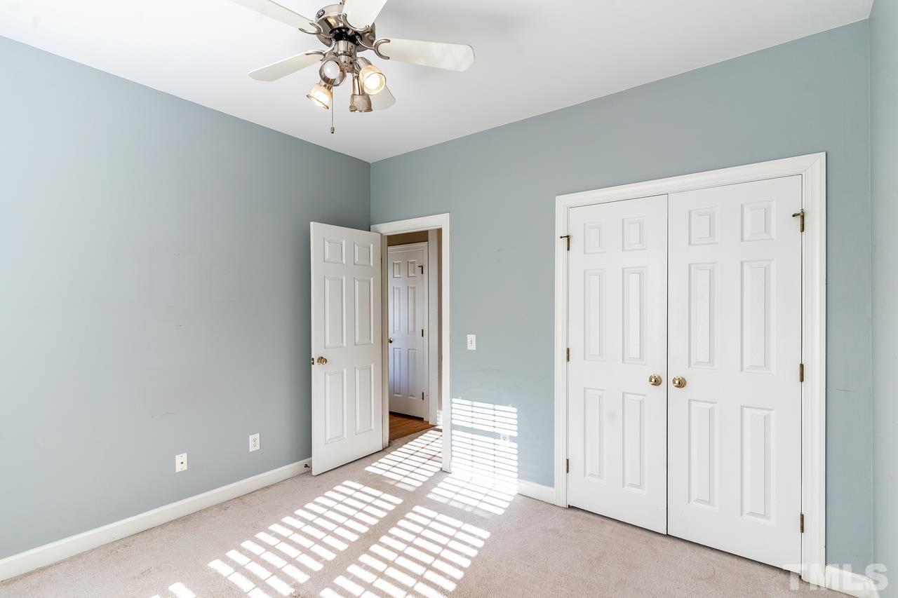 6336 Nowell Pointe Drive Raleigh, NC 27607 - Photo 14 of 25 a view of a room with a chandelier fan