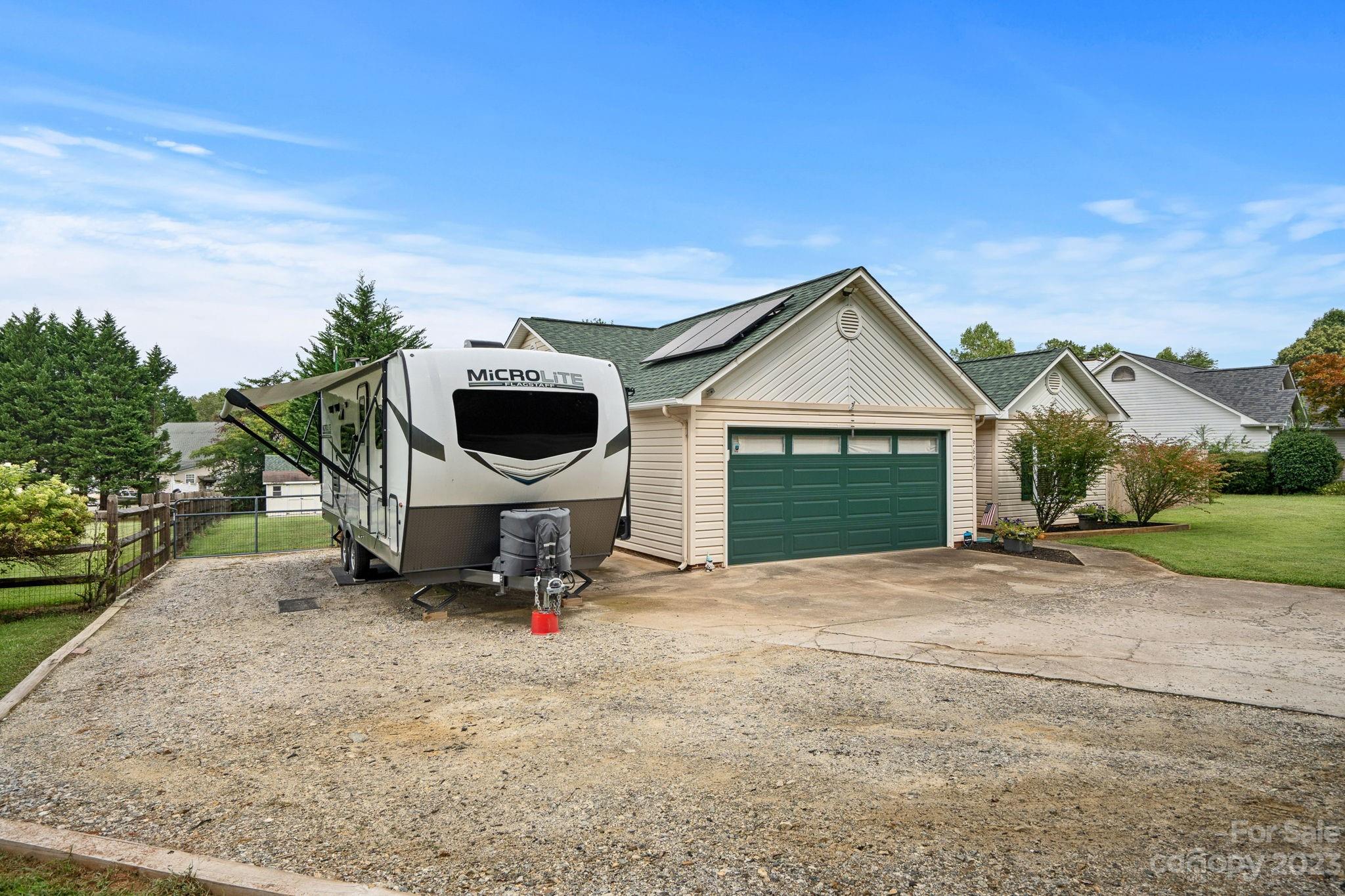 3691 Slanting Bridge Road Sherrills Ford, NC 28673 - Photo 2 of 33 a front view of a house with a yard and garage