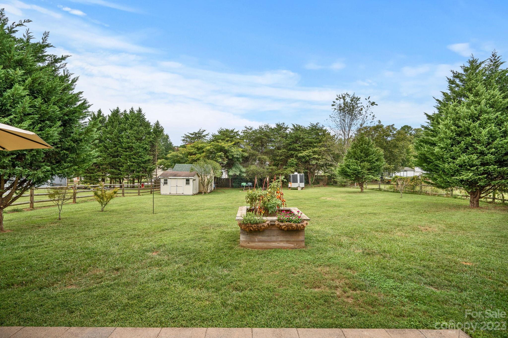 3691 Slanting Bridge Road Sherrills Ford, NC 28673 - Photo 31 of 33 a white house with a yard and a ocean view