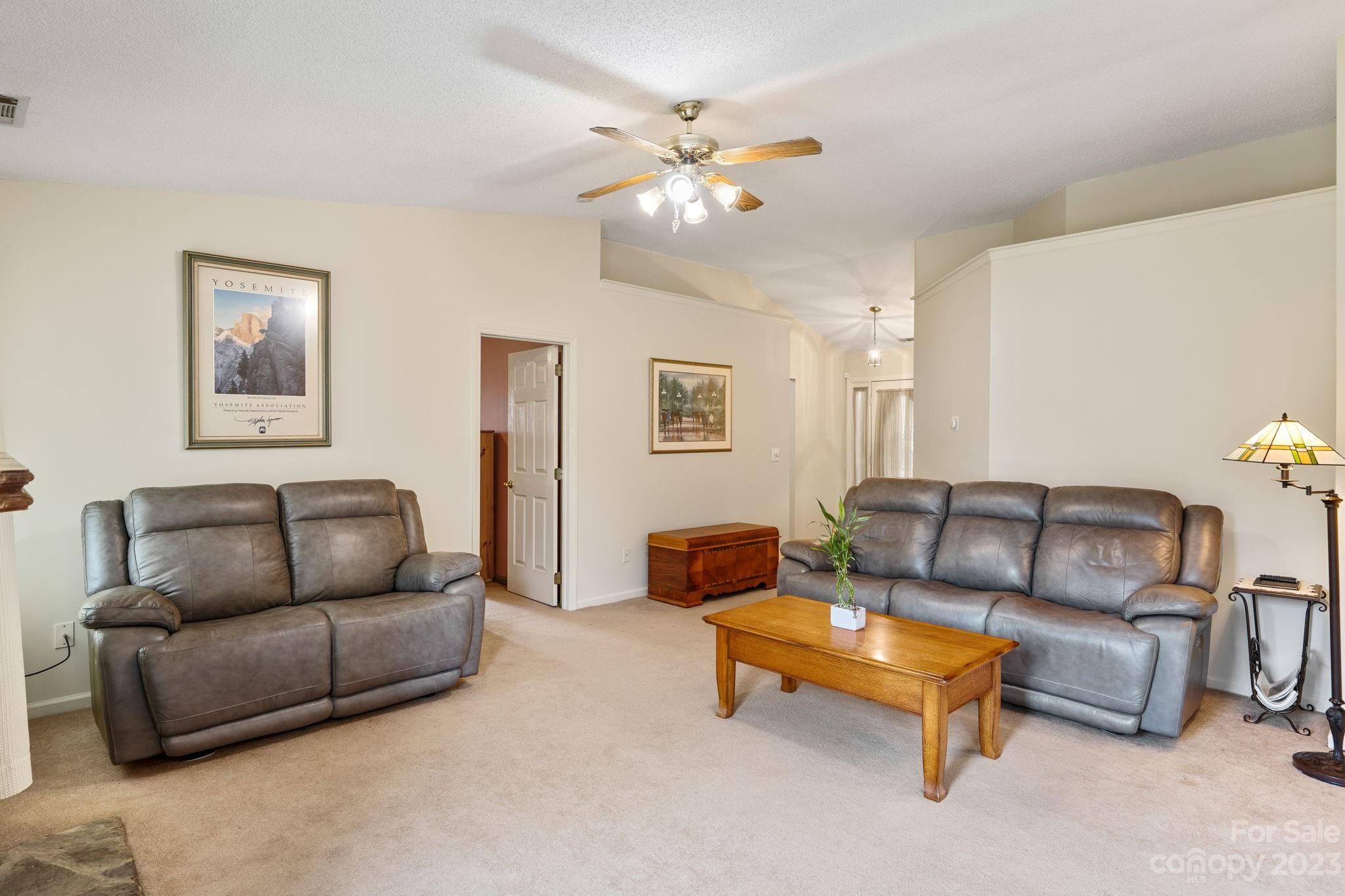 3691 Slanting Bridge Road Sherrills Ford, NC 28673 - Photo 6 of 33 a living room with furniture and a ceiling fan