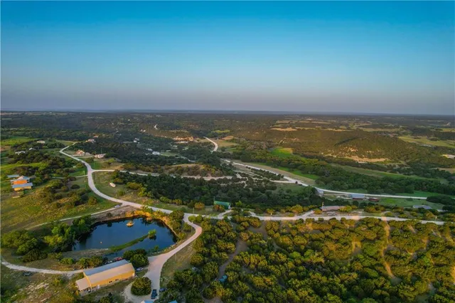 an aerial view of residential building and ocean
