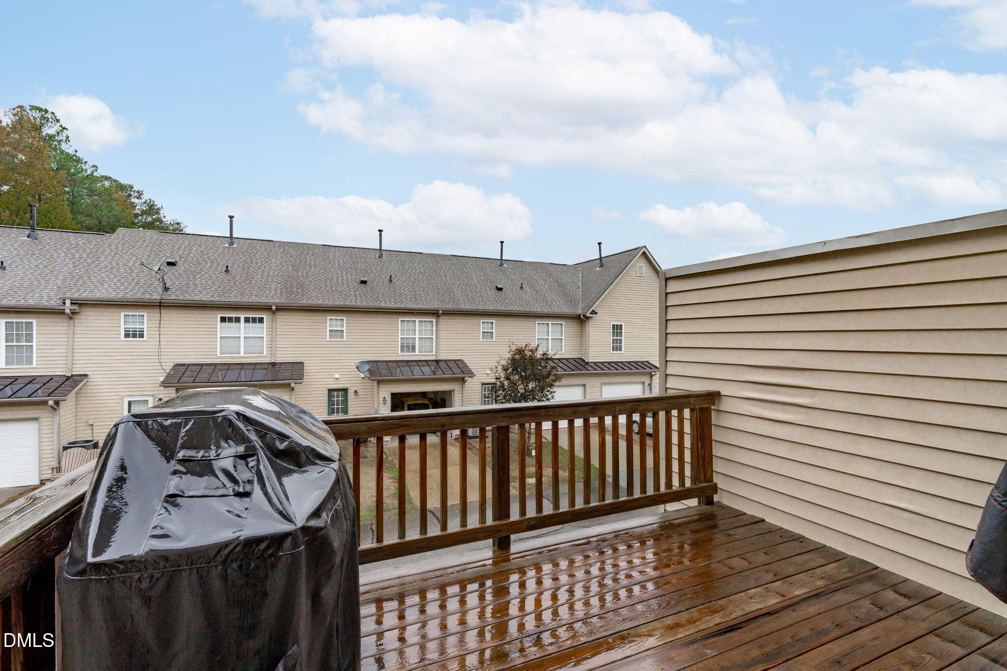 9909 Grettle Court Raleigh, NC 27617 - Photo 19 of 23 a view of a roof deck with wooden fence