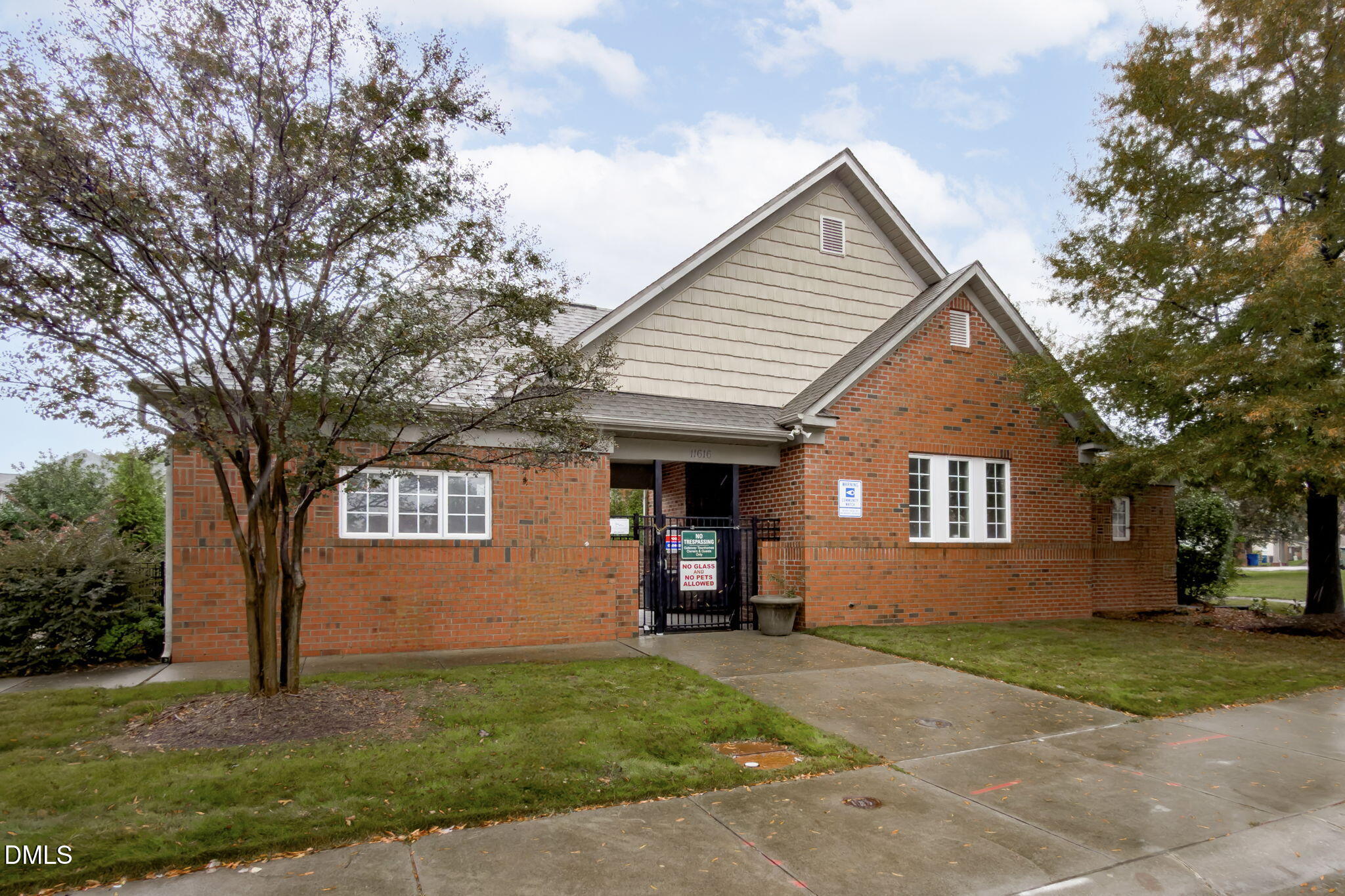 9909 Grettle Court Raleigh, NC 27617 - Photo 22 of 23 a view of a house with a yard and large tree