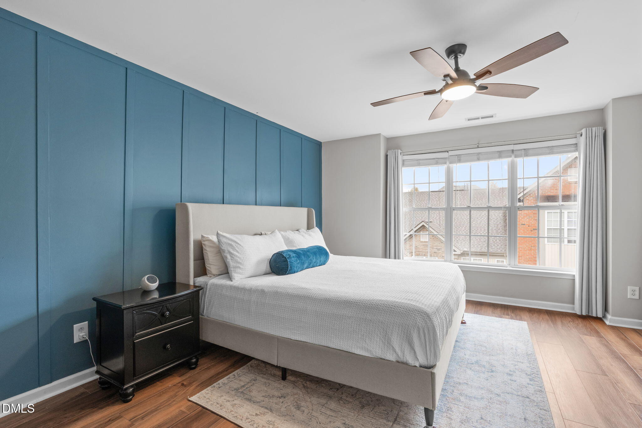 9909 Grettle Court Raleigh, NC 27617 - Photo 4 of 23 a bedroom with a bed and a window