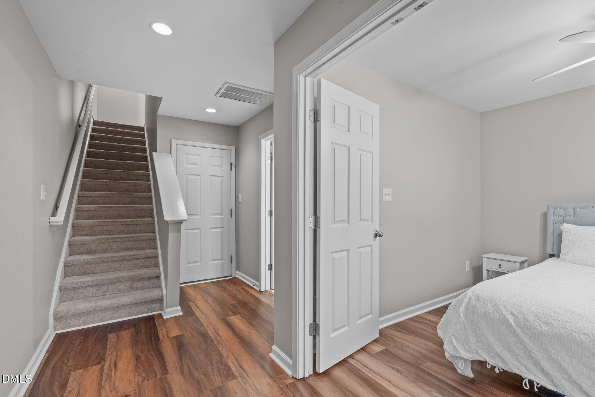 9909 Grettle Court Raleigh, NC 27617 - Photo 5 of 23 a view of a hallway with wooden floor and entryway