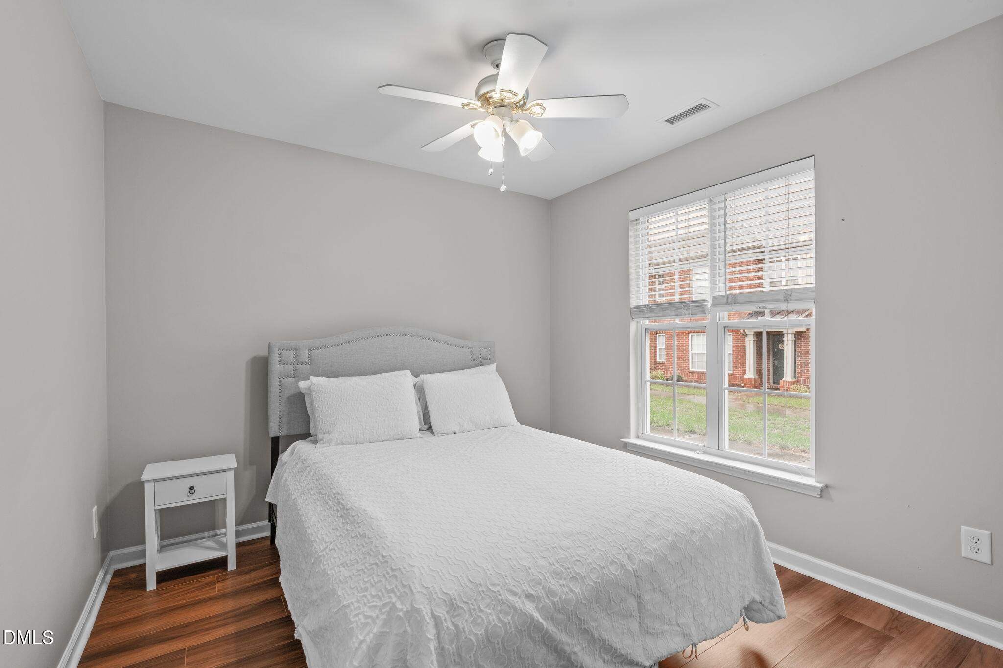 9909 Grettle Court Raleigh, NC 27617 - Photo 6 of 23 a bedroom with a bed and a chandelier