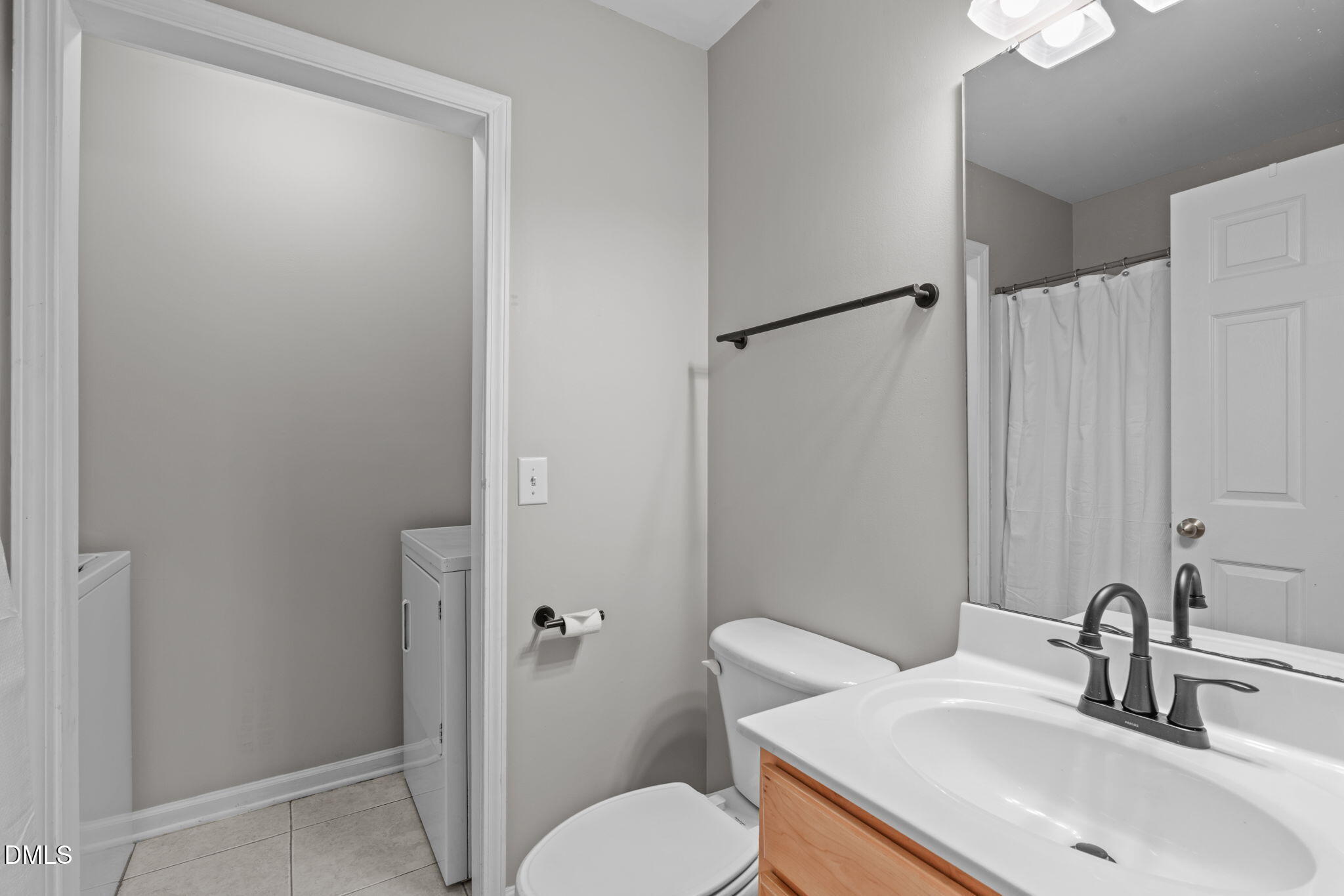 9909 Grettle Court Raleigh, NC 27617 - Photo 7 of 23 a bathroom with a sink toilet and shower