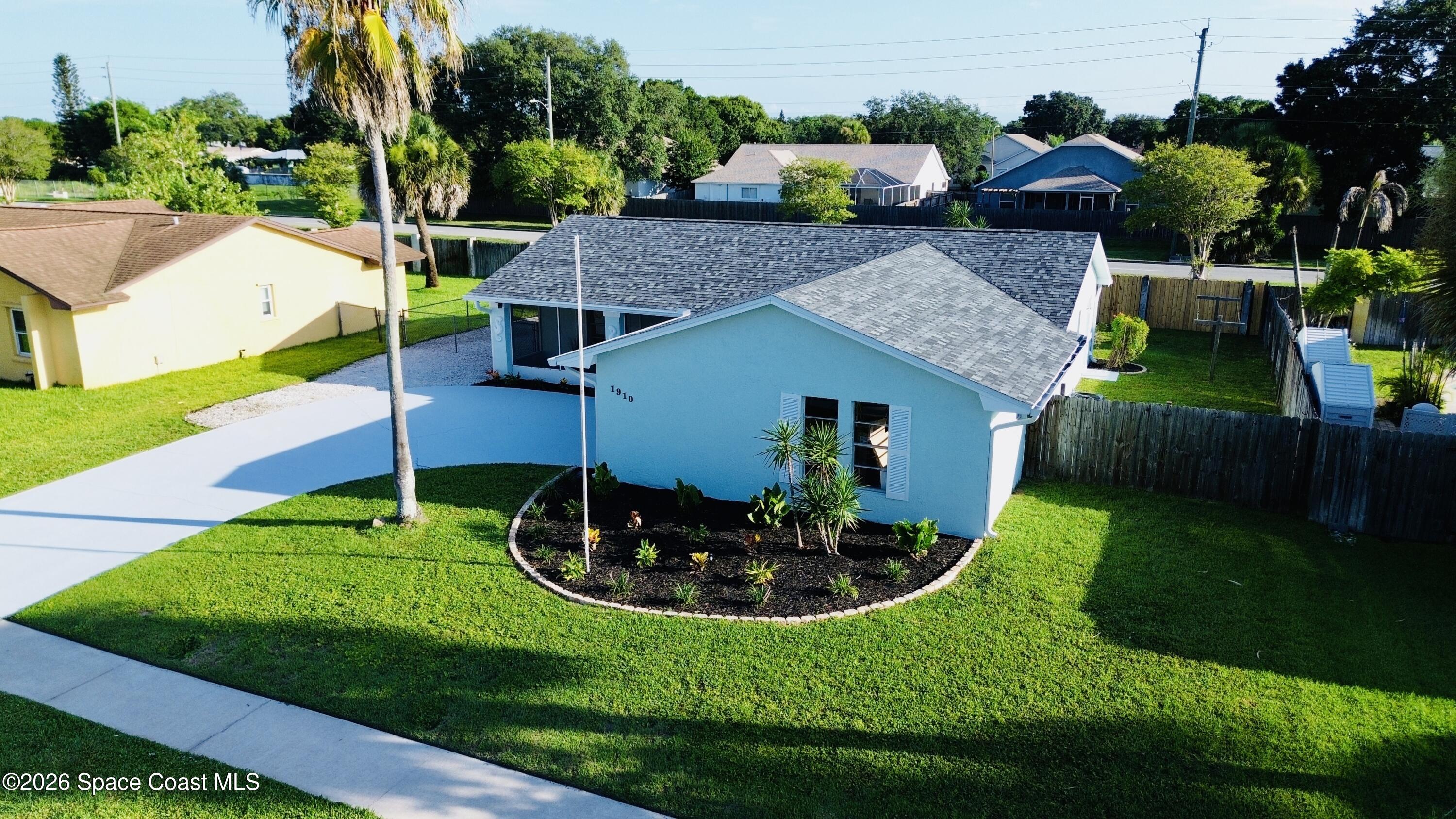 1910 Tallridge Road Melbourne, FL 32935 - Photo 30 of 34 drone front