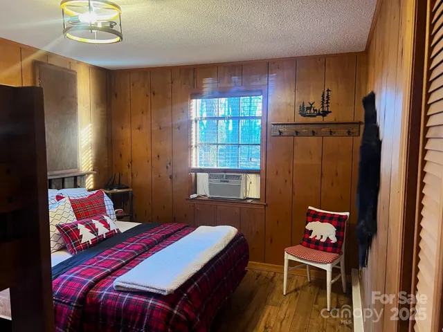 a bedroom with a bed and a closet